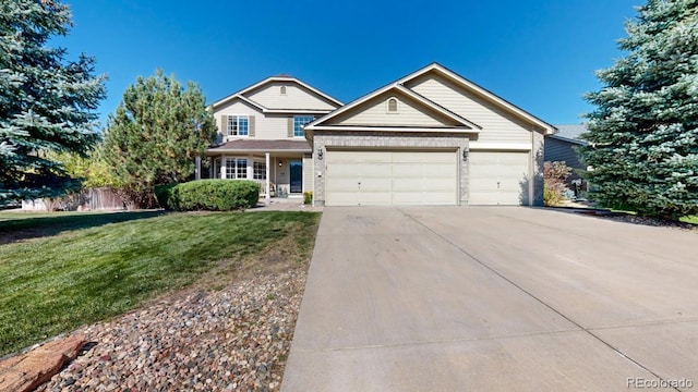 view of front of home featuring a front lawn and a garage