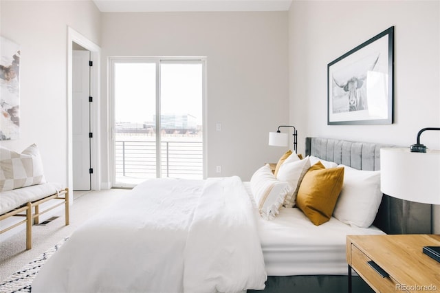 carpeted bedroom featuring access to outside