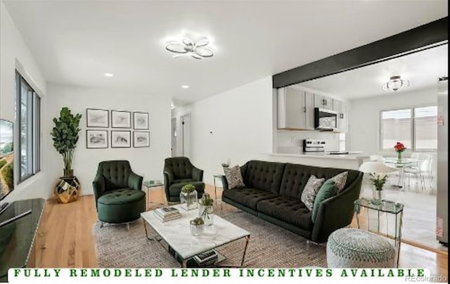 living room featuring wood finished floors and recessed lighting