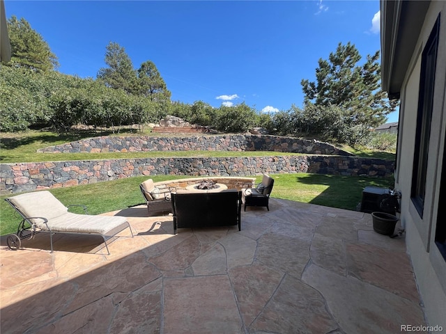 view of patio with a fire pit