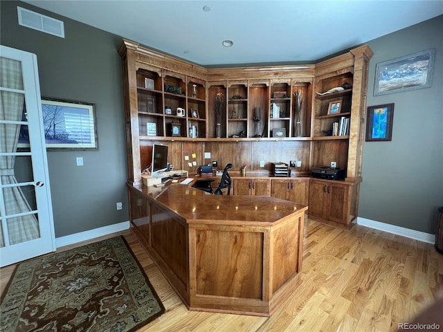 bar featuring light hardwood / wood-style flooring