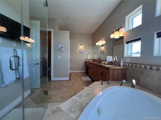 bathroom featuring vanity, shower with separate bathtub, and tile patterned flooring