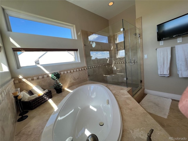 bathroom with independent shower and bath