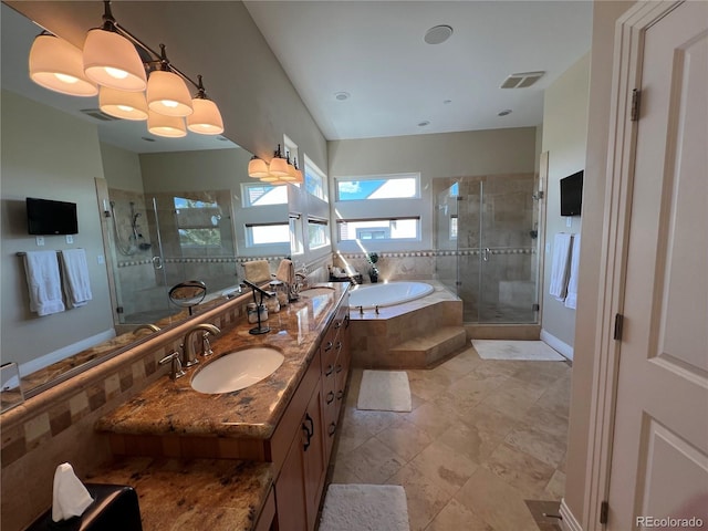 bathroom with vanity and separate shower and tub