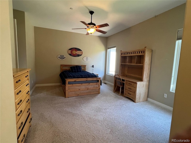 unfurnished bedroom with light colored carpet and ceiling fan