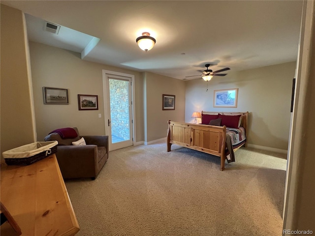 carpeted bedroom featuring access to exterior and ceiling fan