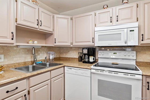 kitchen with sink, white cabinets, and white appliances