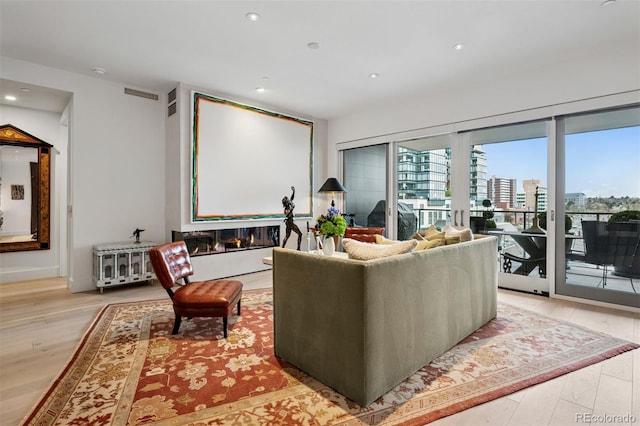 155 Steele St Unit 418, Denver, CO 80206 - cinema room with recessed lighting and light wood-style floors