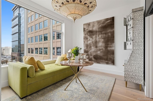 155 Steele St Unit 418, Denver, CO 80206 - sitting room with wood finished floors and baseboards