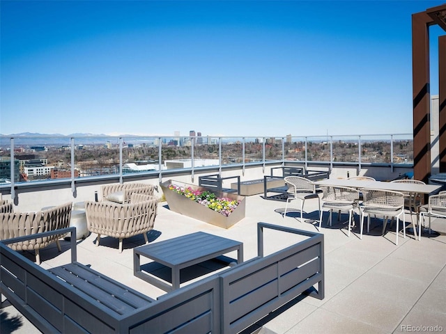 155 Steele St Unit 418, Denver, CO 80206 - view of patio / terrace with outdoor lounge area, a mountain view, and a balcony