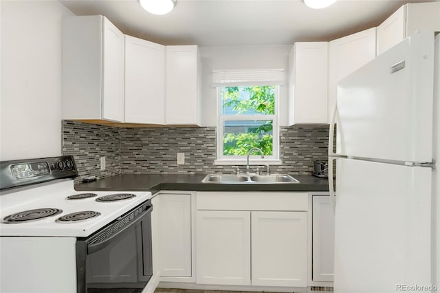 5455 Dudley Ct, Arvada, CO 80002 - kitchen with freestanding refrigerator, electric range oven, a sink, and white cabinets