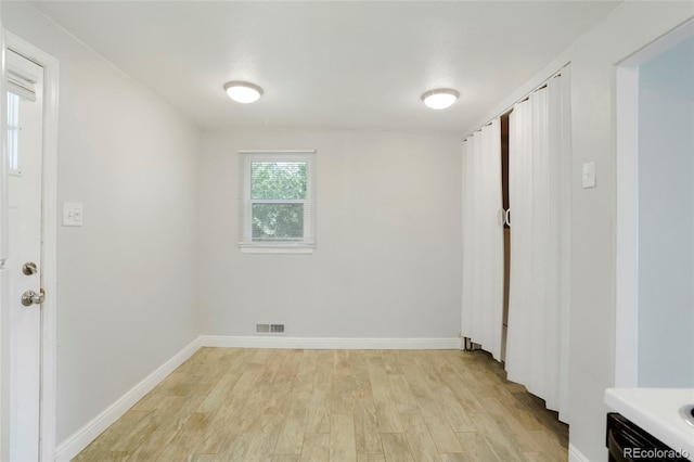 5455 Dudley Ct, Arvada, CO 80002 - spare room featuring light wood-style flooring and baseboards