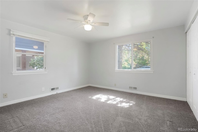 5455 Dudley Ct, Arvada, CO 80002 - spare room featuring carpet floors, a ceiling fan, and baseboards