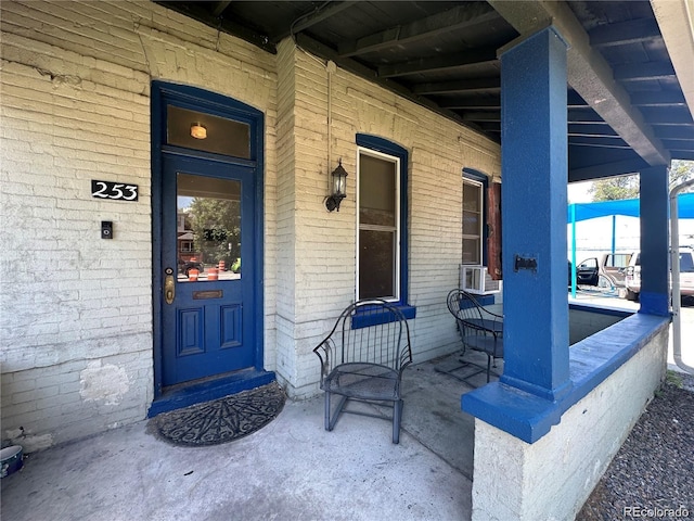 view of exterior entry featuring a porch