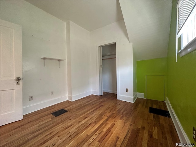 unfurnished bedroom with wood-type flooring