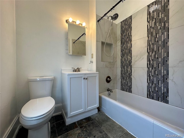 full bathroom featuring toilet, vanity, and tiled shower / bath