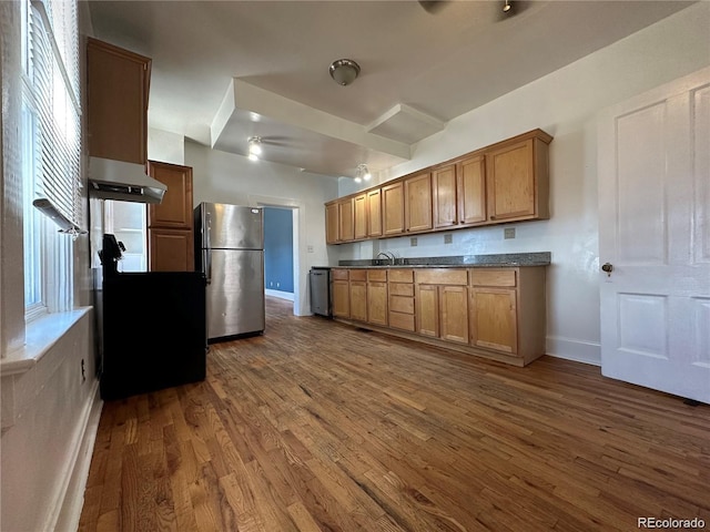 kitchen with stainless steel refrigerator, dark wood-type flooring, and sink