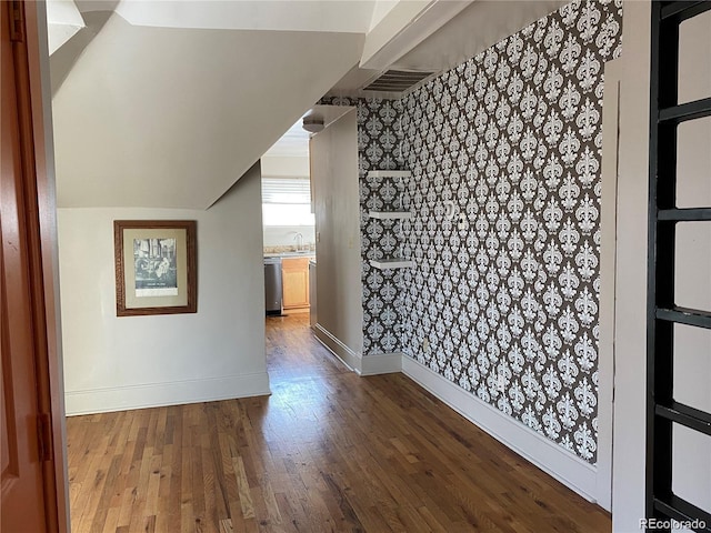 bonus room featuring sink and hardwood / wood-style flooring