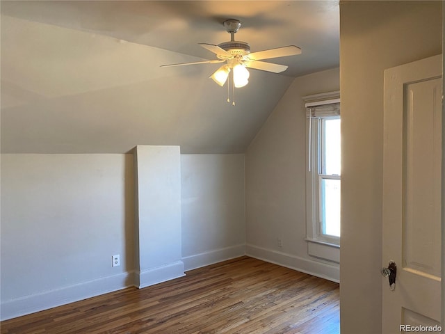 bonus room with ceiling fan, vaulted ceiling, and wood-type flooring