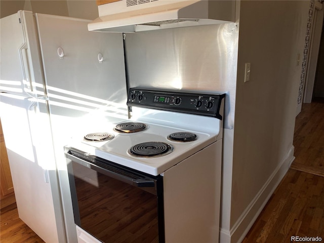 kitchen with extractor fan, wood-type flooring, white range with electric cooktop, and white cabinetry