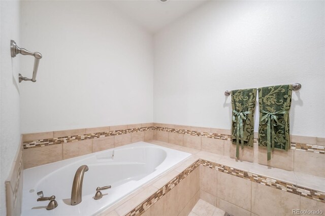 bathroom with tiled bath