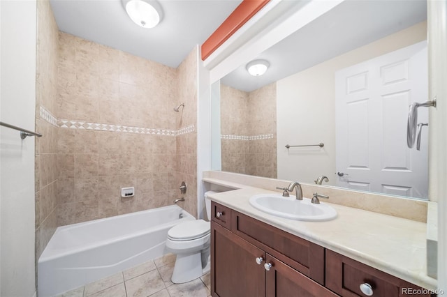 full bathroom featuring toilet, vanity, tiled shower / bath, and tile patterned floors