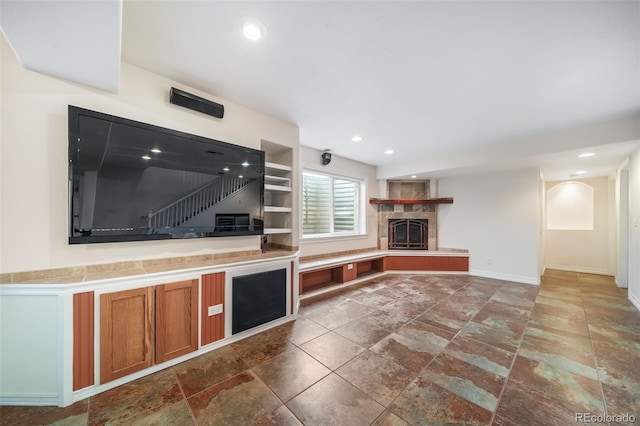 kitchen with a tiled fireplace