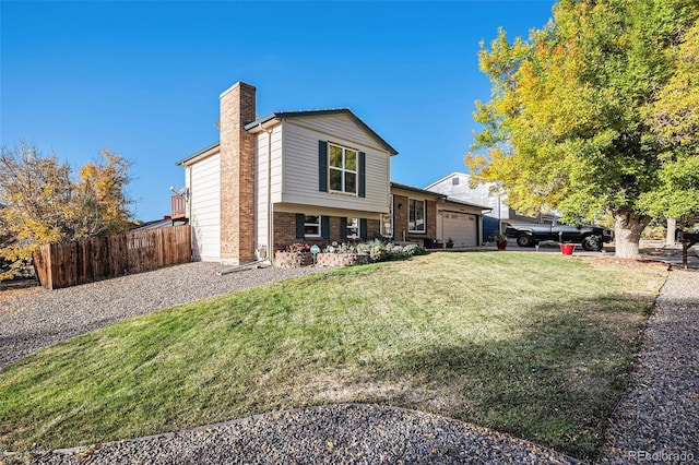 split level home with a garage, brick siding, fence, a front lawn, and a chimney