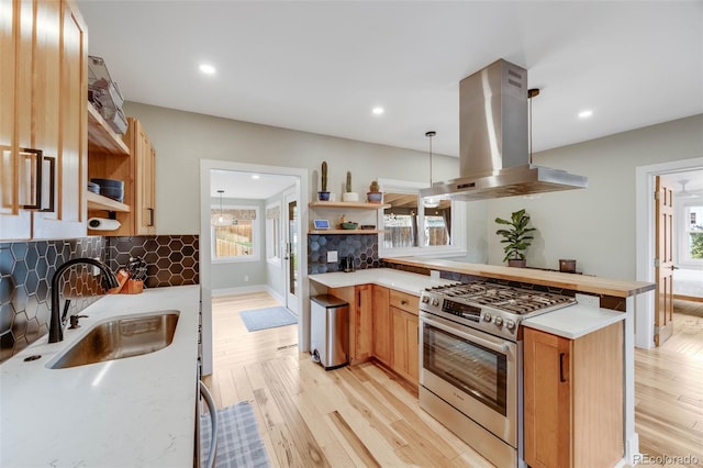 1055 Quartz St, Golden, CO 80401 - kitchen featuring stainless steel range with gas cooktop, island exhaust hood, open shelves, a sink, and recessed lighting