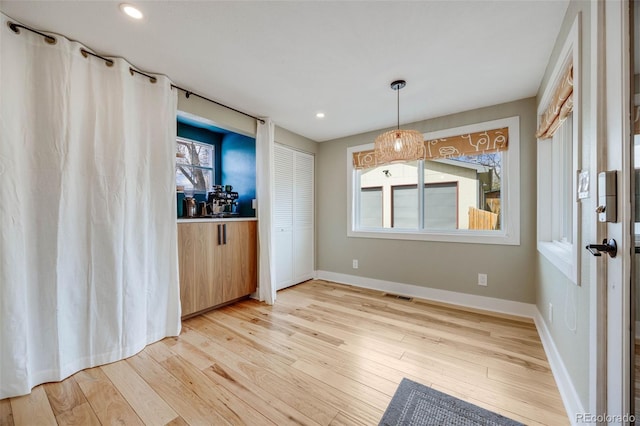 1055 Quartz St, Golden, CO 80401 - unfurnished dining area with light wood-style flooring, baseboards, and recessed lighting