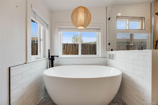 1055 Quartz St, Golden, CO 80401 - full bathroom featuring tile walls and a soaking tub