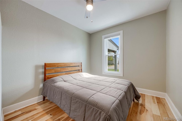 1055 Quartz St, Golden, CO 80401 - bedroom featuring wood finished floors, baseboards, and a ceiling fan