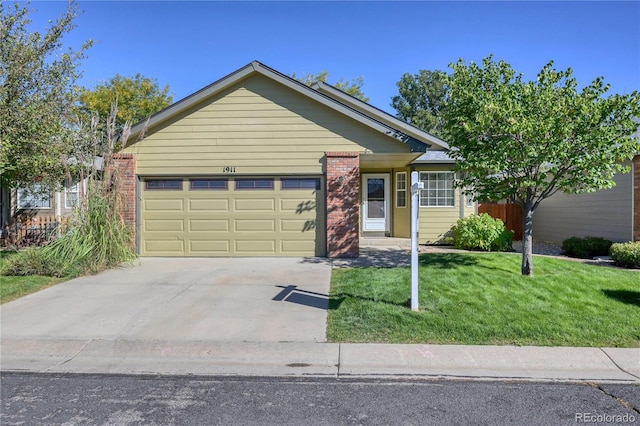 single story home featuring a garage and a front lawn