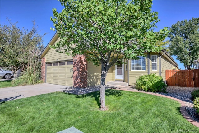 view of property hidden behind natural elements featuring driveway, a front yard, an attached garage, and fence