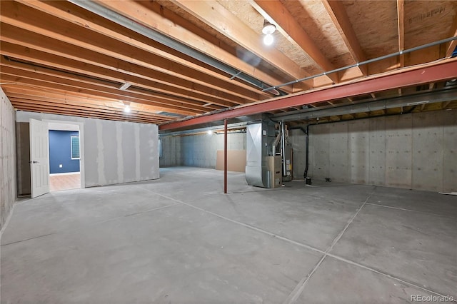 unfinished basement with heating unit