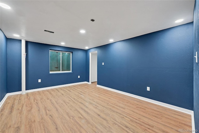 spare room with light wood-type flooring