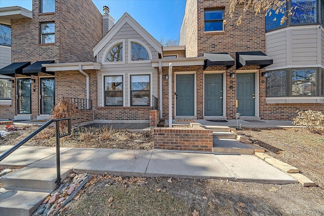 view of front of home featuring brick siding