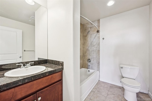 full bathroom with tile patterned floors, vanity, toilet, and tiled shower / bath