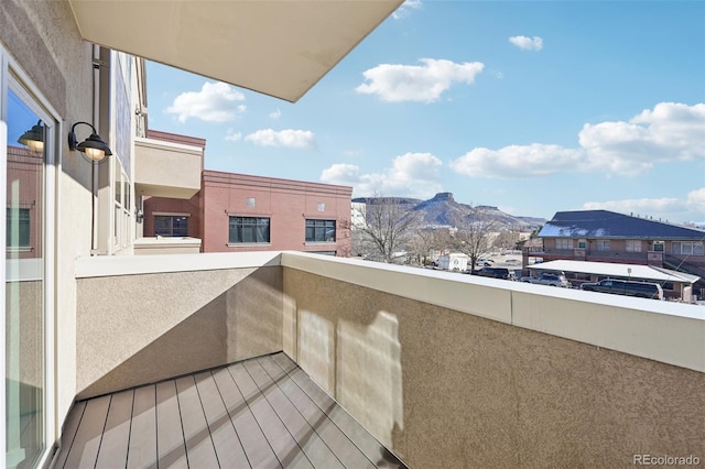 balcony featuring a mountain view