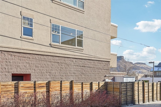 view of side of home featuring a mountain view