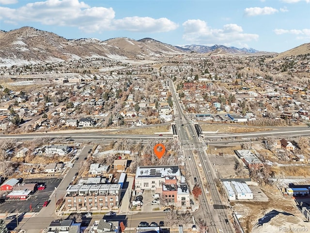 birds eye view of property with a mountain view