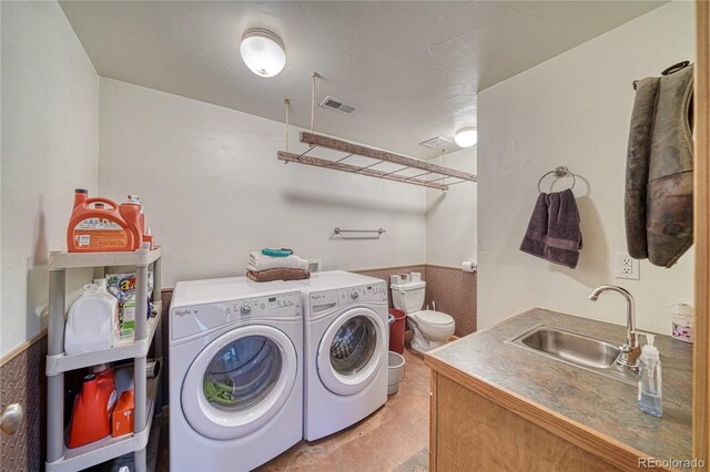 1120 County Road 322, Westcliffe, CO 81252 - washroom with washer and clothes dryer and a wainscoted wall