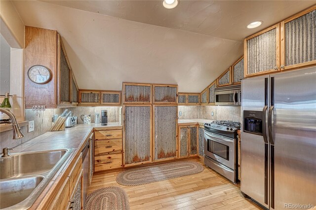 1120 County Road 322, Westcliffe, CO 81252 - kitchen featuring appliances with stainless steel finishes, a sink, light wood-type flooring, vaulted ceiling, and recessed lighting