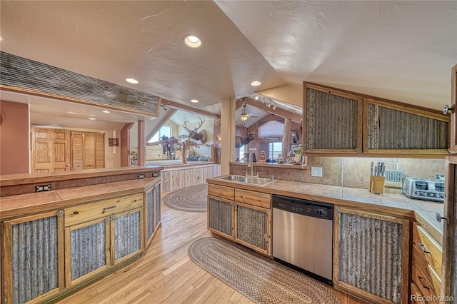 1120 County Road 322, Westcliffe, CO 81252 - kitchen with dishwasher, a sink, light wood-style floors, lofted ceiling, and tile countertops