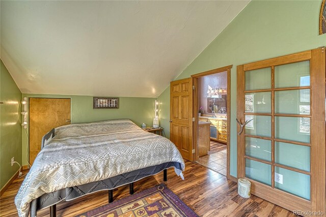 1120 County Road 322, Westcliffe, CO 81252 - bedroom with vaulted ceiling and wood finished floors