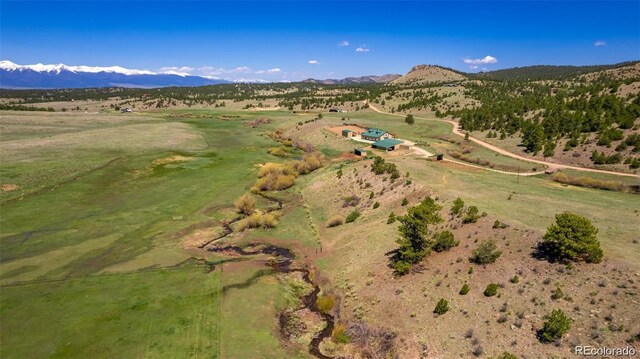 1120 County Road 322, Westcliffe, CO 81252 - aerial view of property's location with a mountainous background and rural landscape