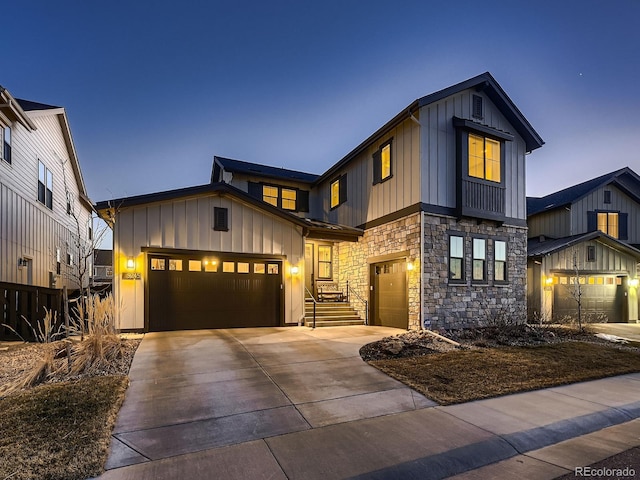 modern inspired farmhouse featuring a garage, board and batten siding, and concrete driveway