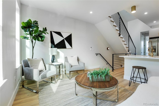 living room with light hardwood / wood-style flooring