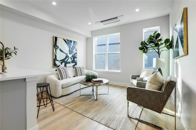 living room with light hardwood / wood-style floors