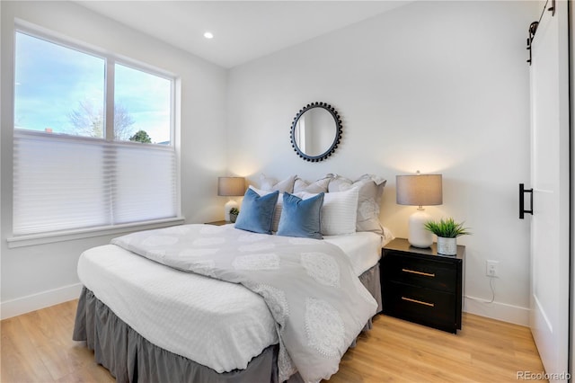 bedroom with light hardwood / wood-style floors